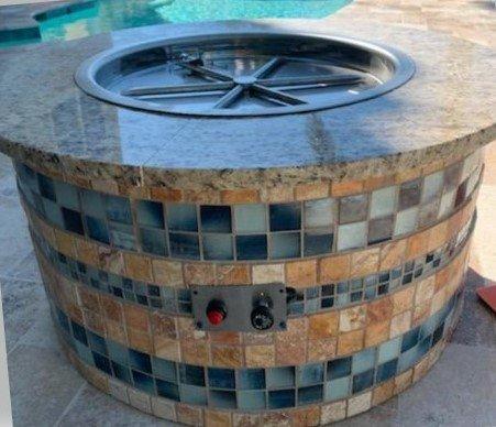 Round residential poolside fire pit