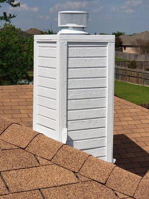 This chimney chase got new trim, a new cap, and a fresh coat of paint.