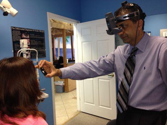 Westoaks office: Dr. Khalfe checking the interior (retina) part of the eyes.