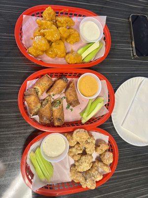 Golden BBQ Not So Classic Boneless Wings (top)   Philly cheesesteak egg rolls (middle)  Garlic parm Boneless Classic Wings (bottom)