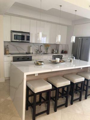 Custom kitchen Cabinetry in White High Gloss Lacquer and Silestone Calacatta Gold Quartz Countertop