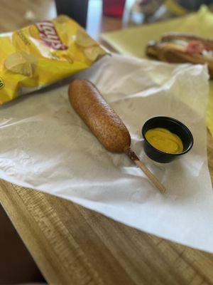 Corn dog, chips n side of mustard and Mr pibb