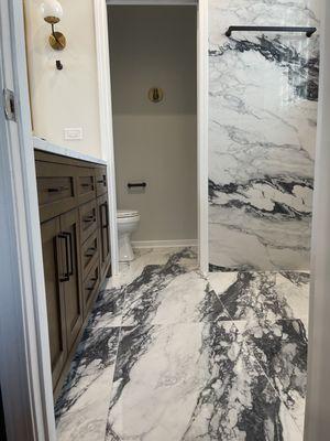 Custom bath Chicago 4x2 tile with walnut double bowl vanity.