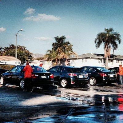 Cars being serviced at Five Points Carwash.