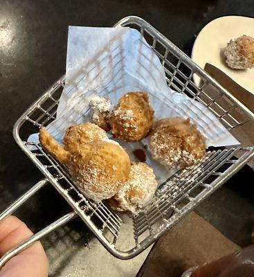 Lemon Beignets (6 in an order) served in a tiny basket