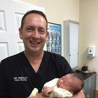 Dr. Findlay holding one of our newest patients after his first adjustment at Mariner Chiropractic.