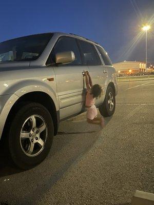 Toddler who wants the keys out of the car so she can get a new diaper