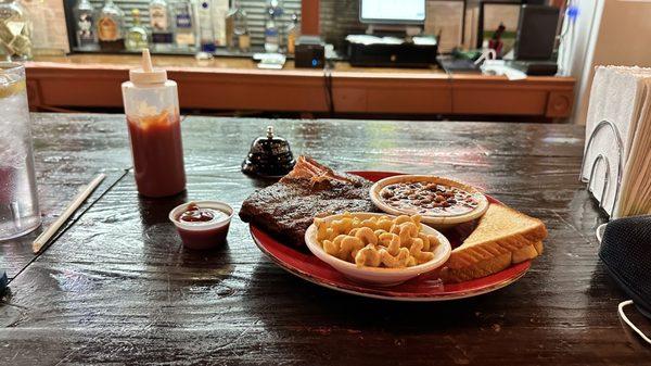 St. Louis style rib dinner plate. With side of Delta Q Baked Beans and Mac & Cheese.  Bbq sauce on the side.