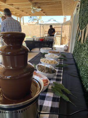 Chocolate Fountain dessert set up and taco man in my backyard by the pool!