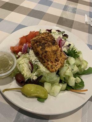 Blackened salmon over a Greek salad