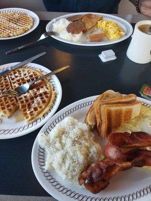 Waffles, grits, eggs, and bacon