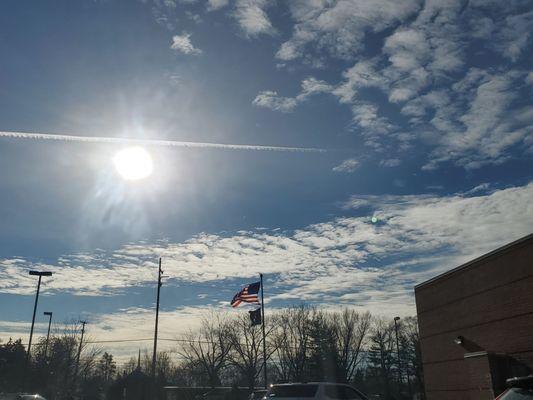 Beautiful Clouds & Sunshine reflects the flags at this Shelby Township USPS.   Thursday 12/14/2023