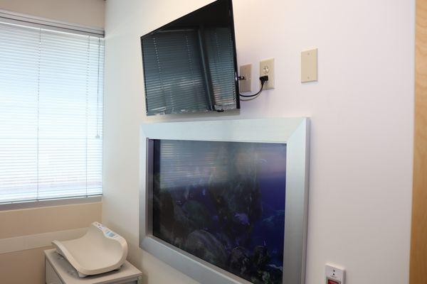 Monitors and virtual fish tanks in the pediatric exam rooms