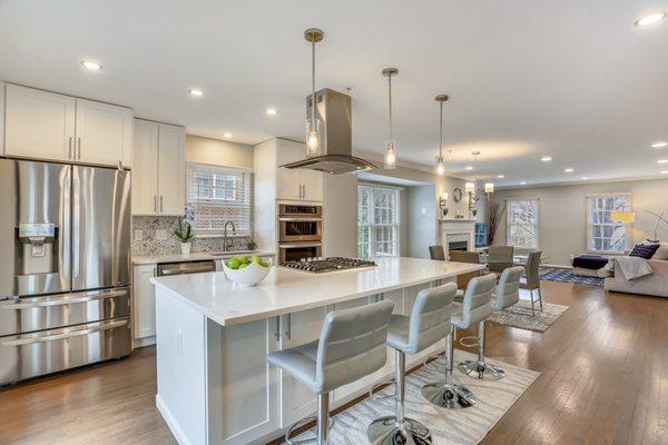 The kitchen open plan design removes walls that separate the kitchen from the living area, allowing for an unobstructed flow between the two