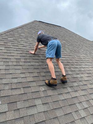 Checking a residential roof at Biloxi, MS