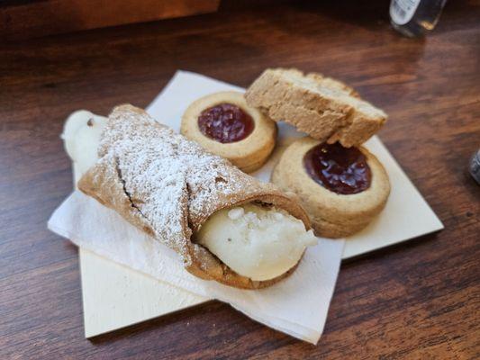 Cannoli, almond dessert, and cookies - complementary from the owners for providing feedback on their drinks!