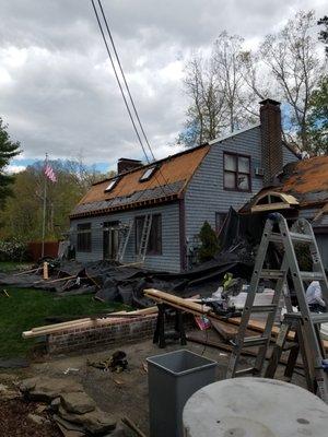 Complete strip of the roof.  They put heavy tarps up for the strip so all the debris avoided the landscaping.