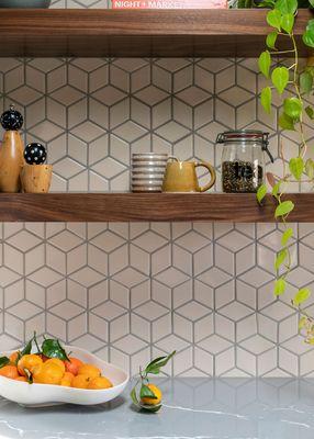 Bold backsplash from fireclay tile creating a 3D affect.