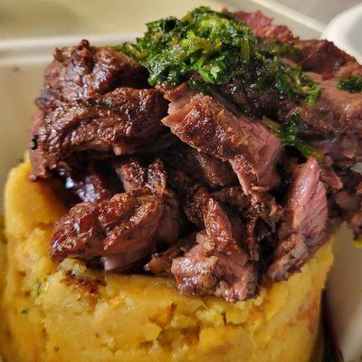 Hanger steak over mofongo