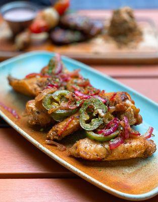 Jawaneh: Mediterranean seasoned chicken wings sautéed w/ onions, jalapeños peppers | $14