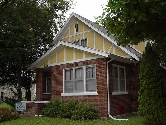 Classic 4 bedroom, one and one half bath brick 1 1/2 story home one a corner lot with fenced yard and detached 2 car garage.