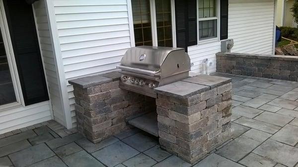 Grilling station built with Unilock Brussels Dimensional blocks.  Unilock Rivenstone surface gives you a place to set grillin...