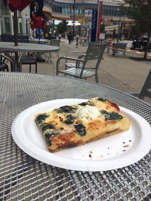 Spinach ricotta pizza outdoor seating