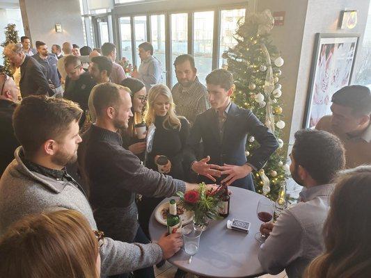 Simon performing close up magic at a company holiday party event