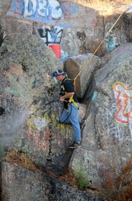 Graffiti Removal from a rock quarry wall in Rocklin, CA.