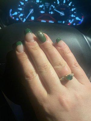 Coffin shaped French tips with green and gold.