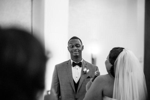 Groom making funny face during ceremony at the Milwaukee Marriott Downtown.