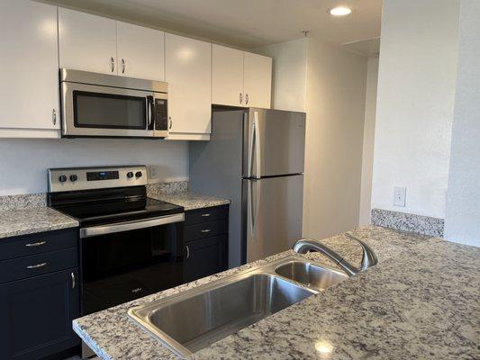 Counters, Backsplash and Bar measured, fabricated and installed by Asset Granite