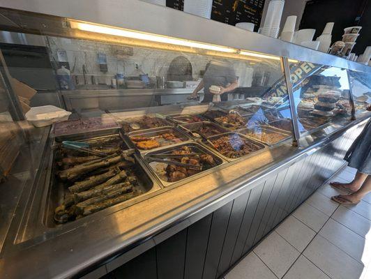 The other end of where the food it. To the left of the photo is where the cashier is.