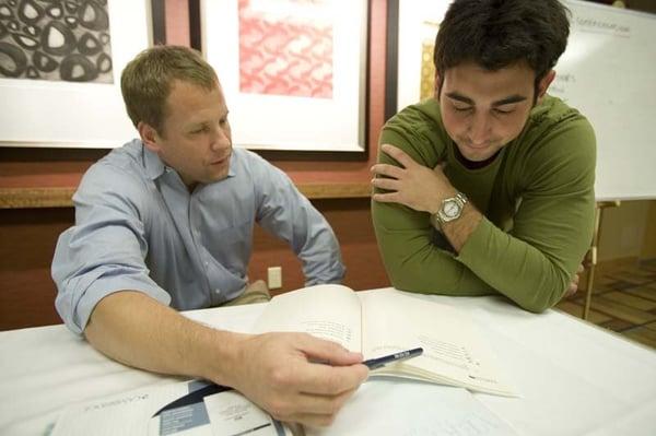 A student and instructor work though a problem together in a recent Veritas Prep GMAT class