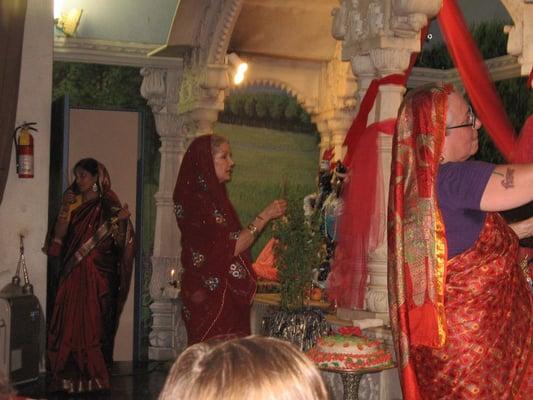 On the feast of Radhastami, 3 female pujaris ascend the altar to celebrate the 8:15PM ceremony.