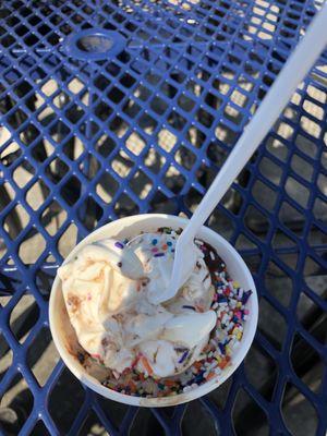 Medium cup with chocolate fudge and sprinkles