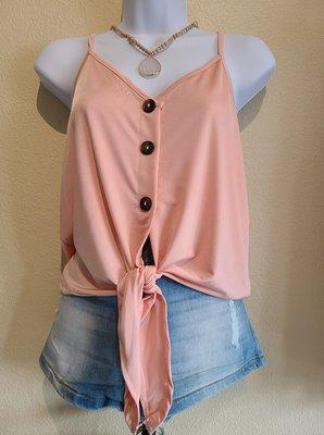 Our V-neck pink tank top pairs perfectly with shorts or jeans for a casual look!