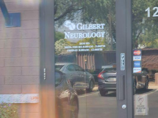 Front door on the right hand side, although the door opens to a shared waiting room with a chiropractic office.