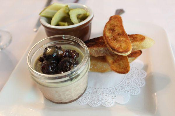 Chicken liver mousse topped with cherries. Served with a side of celery pickles.