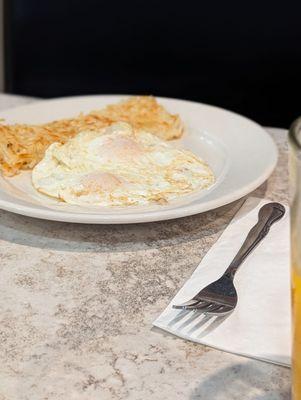 Side of eggs and hash browns.