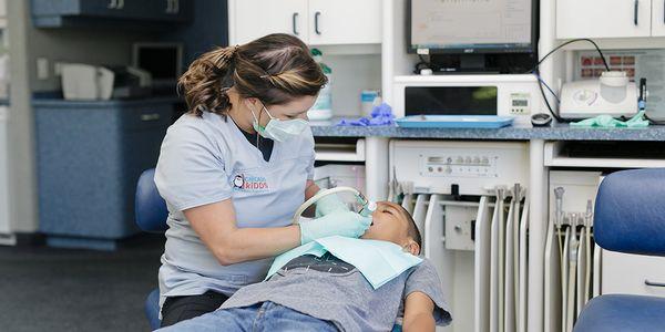 Hygienist Jaclyn with a patient.