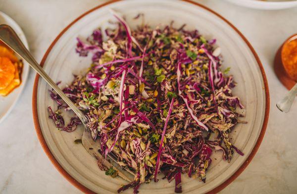 Vegan slaw with smoked corn and a creamy dressing.