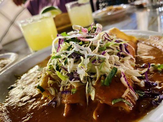 New Mexican Enchiladas Especial...delicious! Don't forget to take advantage of the Happy Hour Margaritas (pictured in the back)!