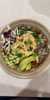 Chicken Poke Bowl with avocado, cucumber, pico de gallo, seaweed salad, cabbage, yum yum sauce, and ponzu sauce