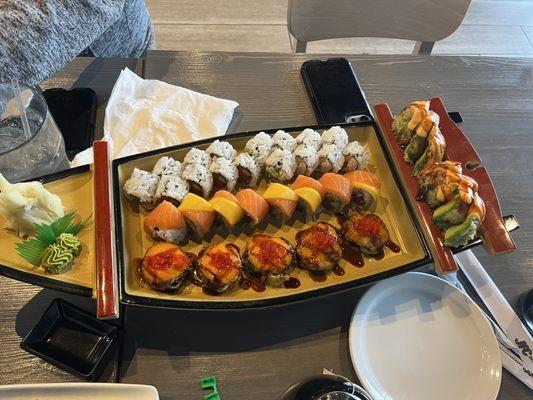 Variety of rolls! Spicy tuna, California roll, sunrise roll, Starlight roll, and Money brain on the right