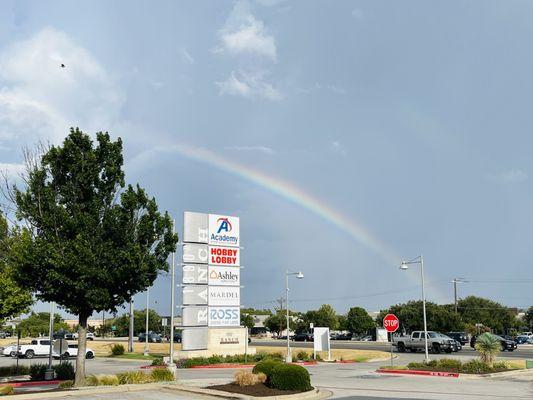 Follow the rainbow to the parking lot near Academy and Verizon