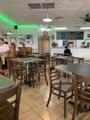 Inside. Tables are marked with a red x to not sit at. People have moved tables and some people were ignoring the red x.