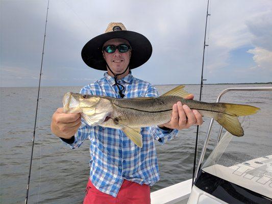 John shows off his biggest snook of the day a nice 27"