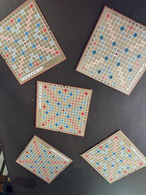 A collection of Scramble game-boards glued to the underside of the staircase.