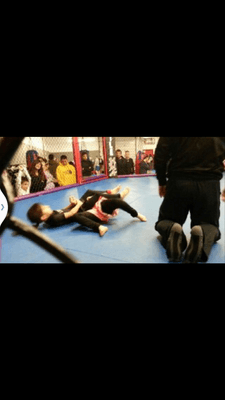 Isabella competing in a grappling competition at FAA